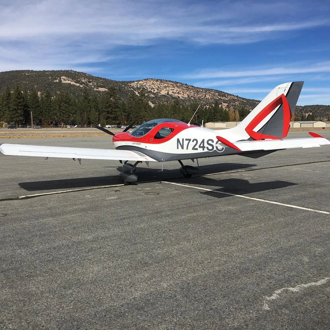 Training aircraft on the ramp with mountains in the background