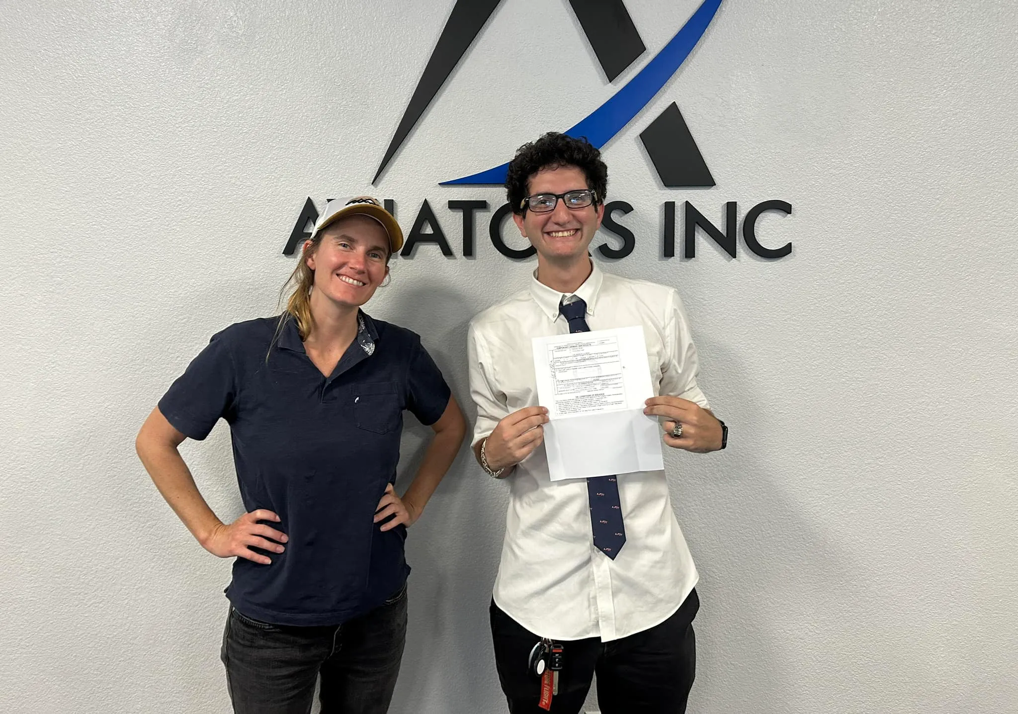 Instructor and student holding a certificate