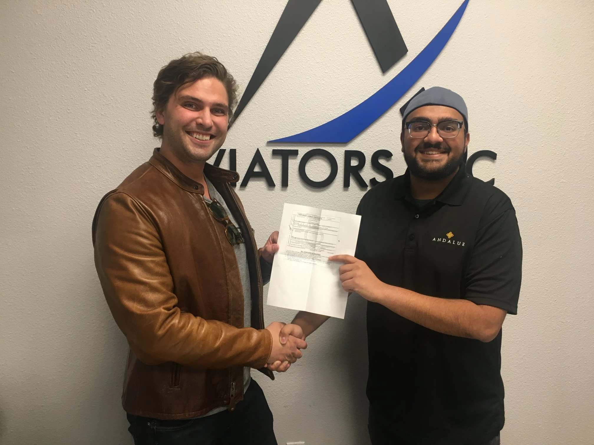 Instructor shaking hands with a student