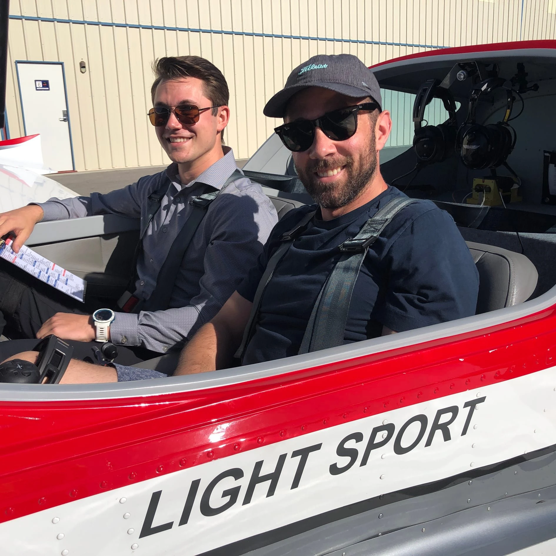Student and instructor inside a training aircraft cockpit