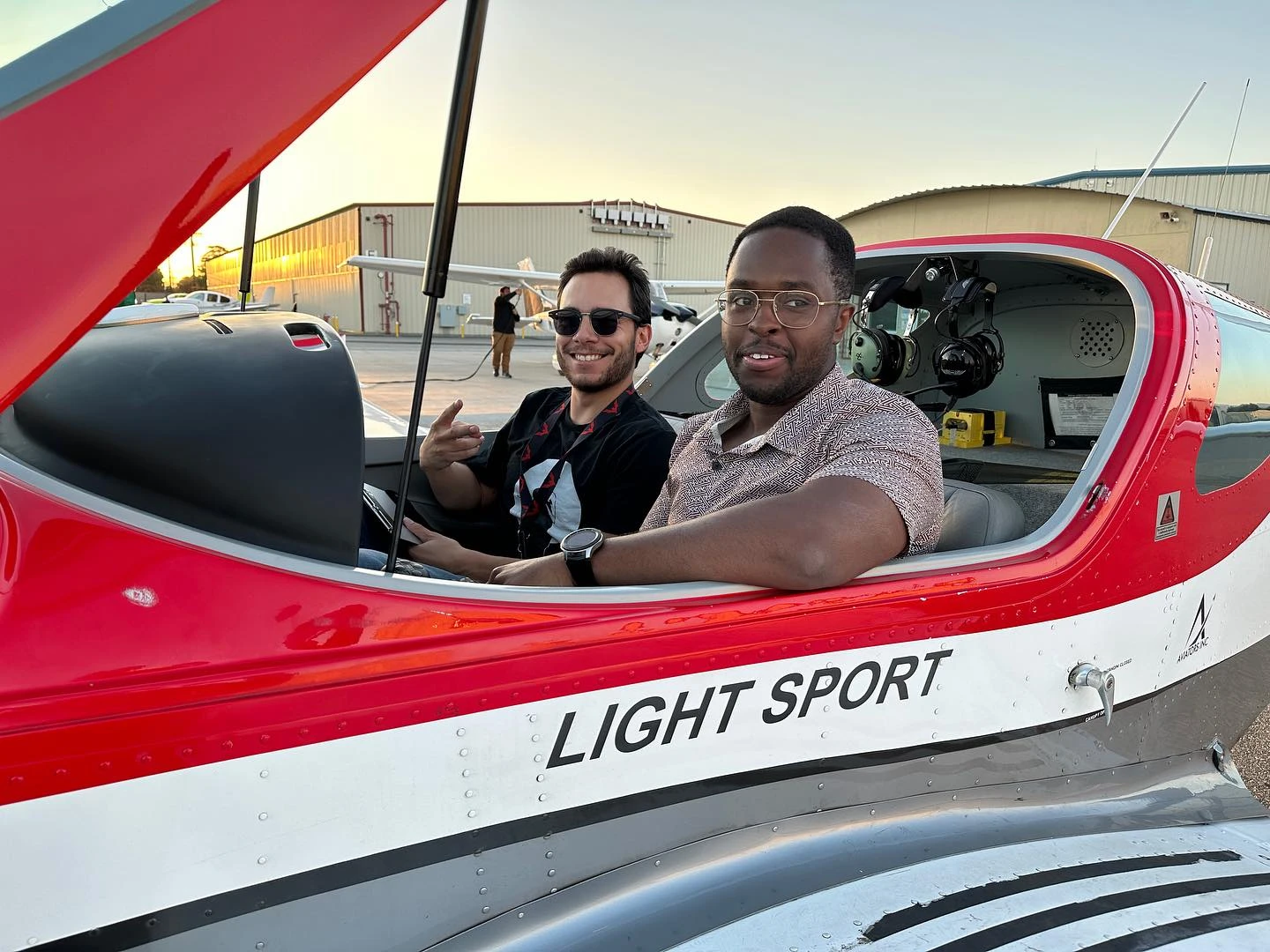 Student and instructor reviewing a lesson inside a training aircraft